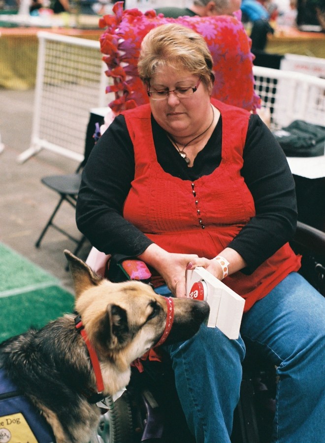 "Bump!"  Last month at Cincinnati's Everything Pet Expo, Amy Hoh showed how her service dog, Cortez, opens doors for her.